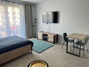 Łóżko lub łóżka w pokoju w obiekcie Harmonia Apartments