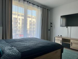 Łóżko lub łóżka w pokoju w obiekcie Harmonia Apartments