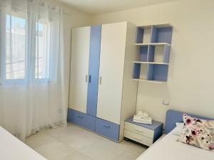 Łóżko lub łóżka w pokoju w obiekcie Appartamenti Villa Campo Rosso