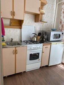 A kitchen or kitchenette at Квартира
