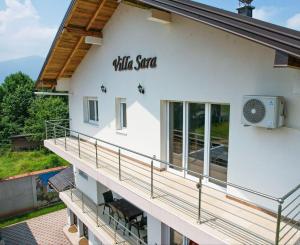 a building with a balcony with the words little spa on it at Villa Sara in Sarajevo