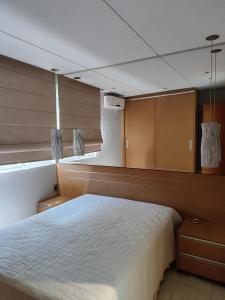 a bedroom on a boat with a bed and a window at Thermas Paradise in Rio Quente