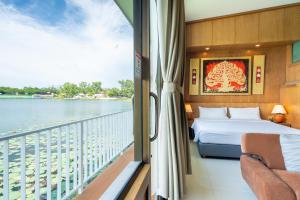 Posteľ alebo postele v izbe v ubytovaní Chabana Resort Bang-tao Beach Phuket- SHA Extra Plus
