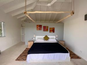 Postel nebo postele na pokoji v ubytování Casa Bambu - Charming villa in the heart of nature