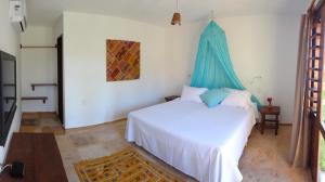 En eller flere senge i et værelse på Villa Albergaria