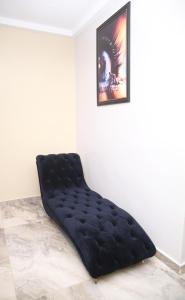 a black bean bag bed in a corner of a room at Newly Built 2 Bedroom Tastefully Furnished House Available For Shortlet. in Lagos