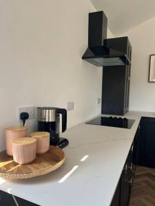 a kitchen with a counter with a coffee maker on it at The guest House in Penrith