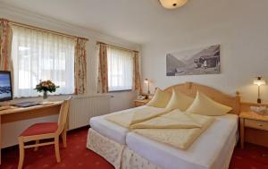 En eller flere senge i et værelse på Hotel Glockenstuhl