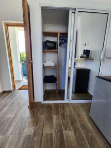 a room with a sliding glass door in a room at Bella Villa room with large pool and close to beach in Las Galeras