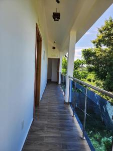 a corridor of a house with a balcony at Bella Villa room with large pool and close to beach in Las Galeras +32 photos