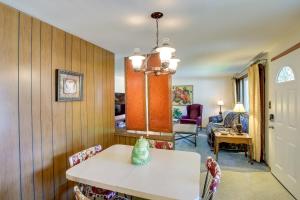 a dining room with a table and chairs at Retro Green Bay Home Steps to Lambeau Field! in Green Bay