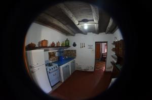 a view of a kitchen with blue appliances at Casamora in Belén