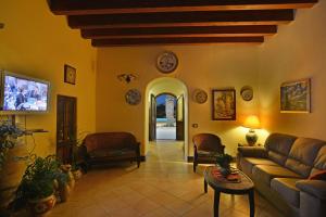 a living room with a couch and a table at Torre Tabia in Sciacca