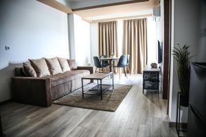 a living room with a couch and a table at Lena_Lux in Jagodina