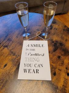 a smile is the quickest thing you can wear with two wine glasses at Willi's Moselschlösschen in Neumagen-Dhron