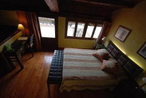 Cama o camas de una habitación en Casa rural Daudén