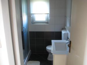 Koupelna v ubytování Apartment Belas