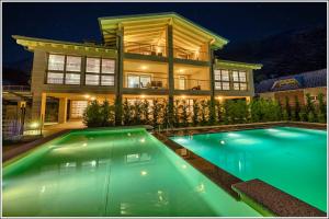 a house with a swimming pool in front of a house at Villa TaDi LaRo Luxury Relax Comer See Colico in Carriola