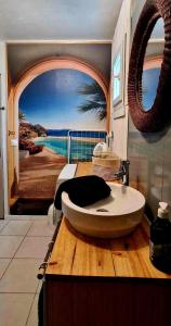 a bathroom with a bath tub on a wooden counter at L'entre deux Breizh 