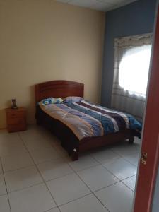 Giường trong phòng chung tại CASA DE CAMPO EL AMAZONICO