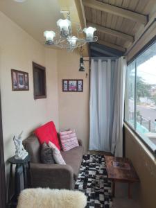 Posezení v ubytování Apt com vista para o mar