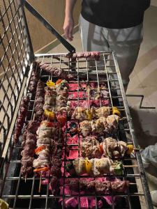 a grill with many different types of food on it at Spacious Penthouse Chalet at Telal Sokhna in Ain Sokhna