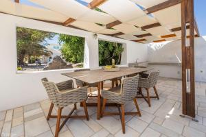 a dining room with a table and chairs at Dolphin Estate 1868 in Megalokhori