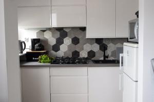 Kuchyňa alebo kuchynka v ubytovaní Na chmury i góry - apartament