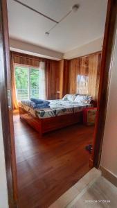 Postel nebo postele na pokoji v ubytování Tigerhill Homestay