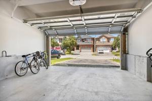a garage with two bikes parked in it at The cozy corner House in the Richmond Hill in Richmond Hill
