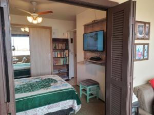 Postel nebo postele na pokoji v ubytování Apt com vista para o mar