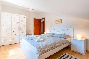 Posteľ alebo postele v izbe v ubytovaní Apartmani Utmar Cres