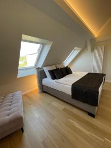 a bedroom with a bed and a large window at SUITE WARTBURGBLICK direkt am Bahnhof in Eisenach