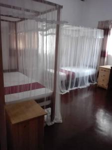 a bedroom with two bunk beds and a window at The Blue Heron Villa in Kandy +12 photos