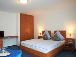 En eller flere senger på et rom på Hotel Münster