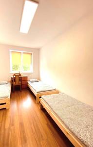 Ein Bett oder Betten in einem Zimmer der Unterkunft Hostel Warszawa Ursynów