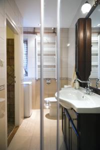 a bathroom with a sink and a toilet at Apartment Julijan in Varaždin