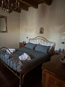 a bedroom with a bed with two towels on it at B&B Santa Maria in Forino