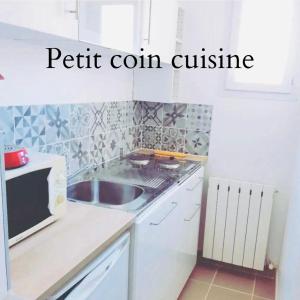 Kuchyňa alebo kuchynka v ubytovaní l'aVentoux're