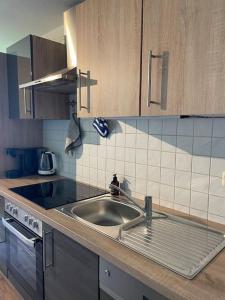 a kitchen with a sink and a counter top at Ferienwohnung in Antonshöhe, Nahe Stoneman in Antonshöhe