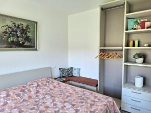 a bedroom with a bed and a book shelf at Dolce Far Niente in Alassio