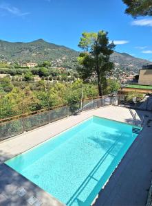 a swimming pool on the roof of a house at Dolce Far Niente in Alassio