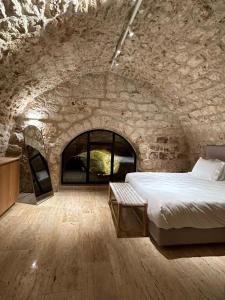 Postel nebo postele na pokoji v ubytování Hagafen Boutique Suites