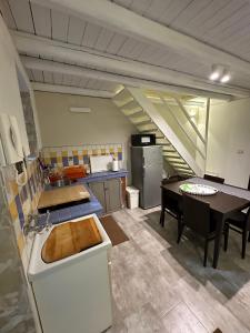 a kitchen with a sink and a table in it at Andive in Syracuse