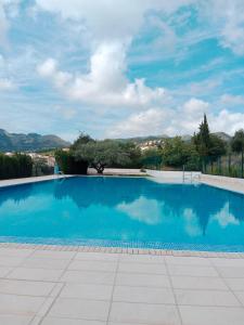 a large blue swimming pool with a view at La Milotxa in Adsubia