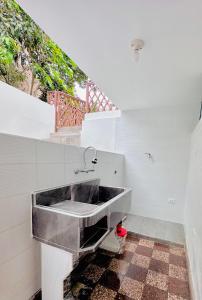 a kitchen with a sink in a room at Casa Verde Jesús María - Zona Residencial in Lima