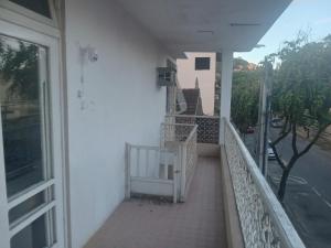 a balcony of a house with a stair case at Hostel Leonardo 10 Estrelas in Vitória