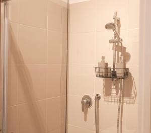 a bathroom with a shower with a glass door at Civico 100 in Terni