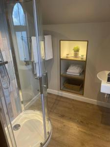 a bathroom with a shower and a sink at Cedar Cottage in Eckington +23 photos
