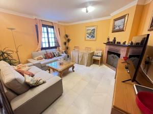 Televízia a/alebo spoločenská miestnosť v ubytovaní Casa Plaza Sierra Grazalema